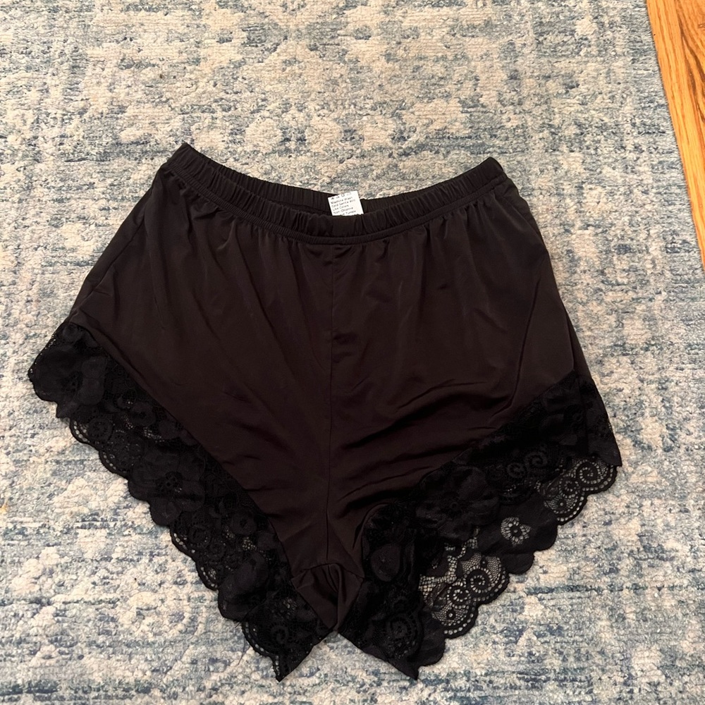 Black silk shorts with lace trim